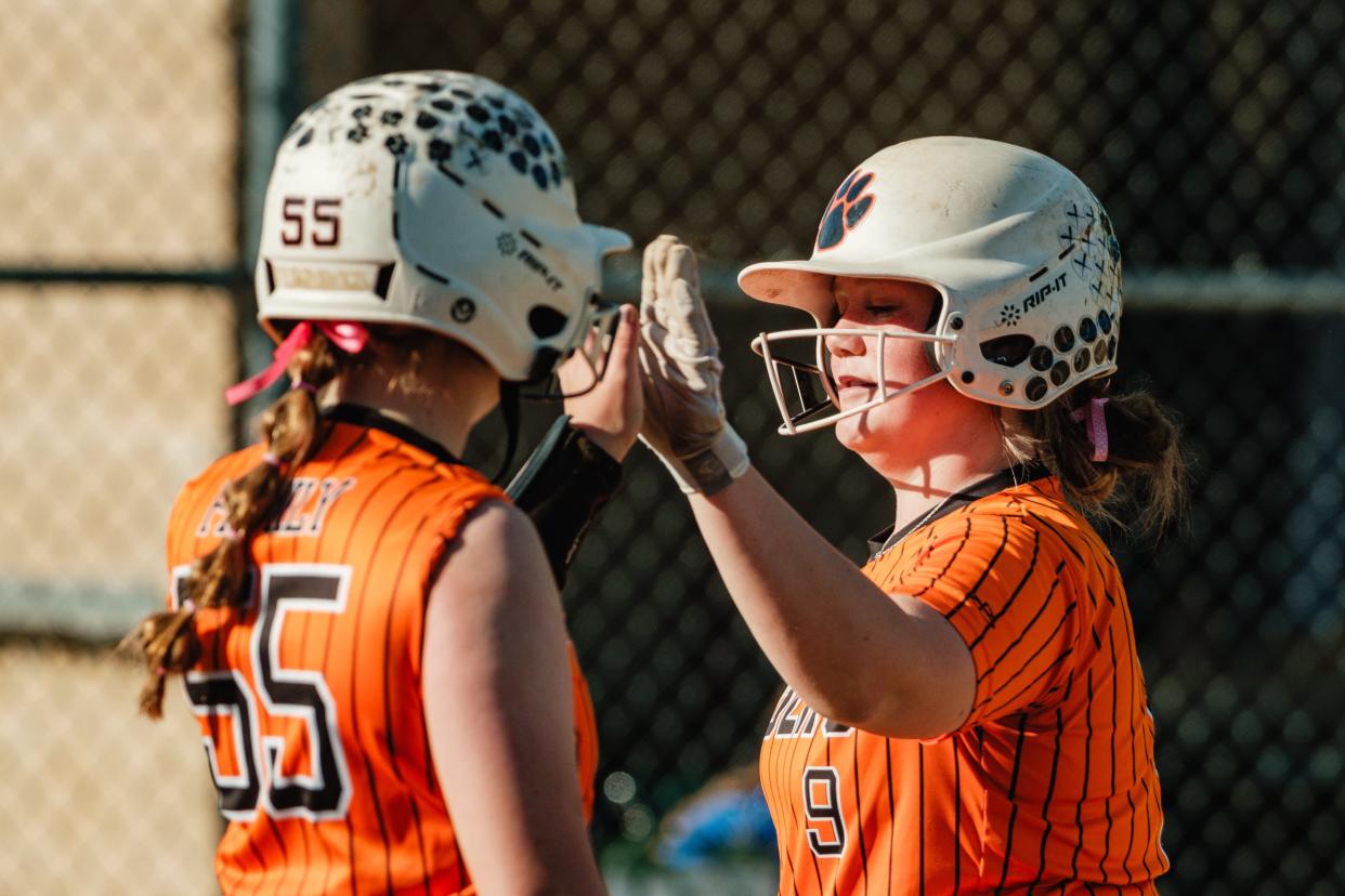 Strasburg's Ada Richards, left, high-five's Keagyn Kramer during a game against Buckeye Trail, Tuesday, April 30 at Strasburg-Franklin Park, in Strasburg.