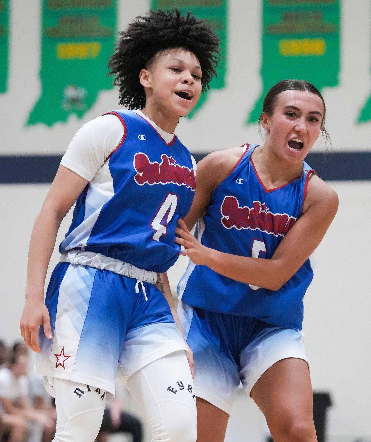 Junior All-Star Jordyn Poole (4) and Indiana All-Star Junior Reagan Wilson (5) yell in excitement Wednesday, June 7, 2023, during the Indiana All-Stars vs. Juniors girls game at Cathedral High School in Indianapolis. 