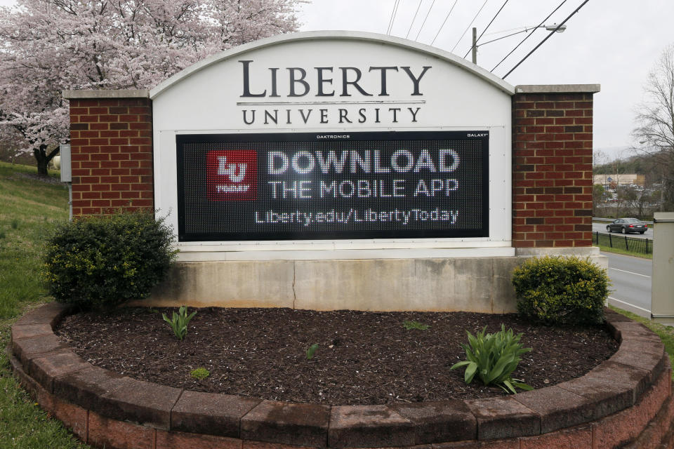 FILE - A sign marks the entrance to Liberty University in Lynchburg, Va., March 24 , 2020. Liberty University failed to warn its Virginia campus community about safety threats, including from individuals accused of sexual violence, according to a Washington Post report published on Tuesday, Oct. 3, 2023. (AP Photo/Steve Helber, File)