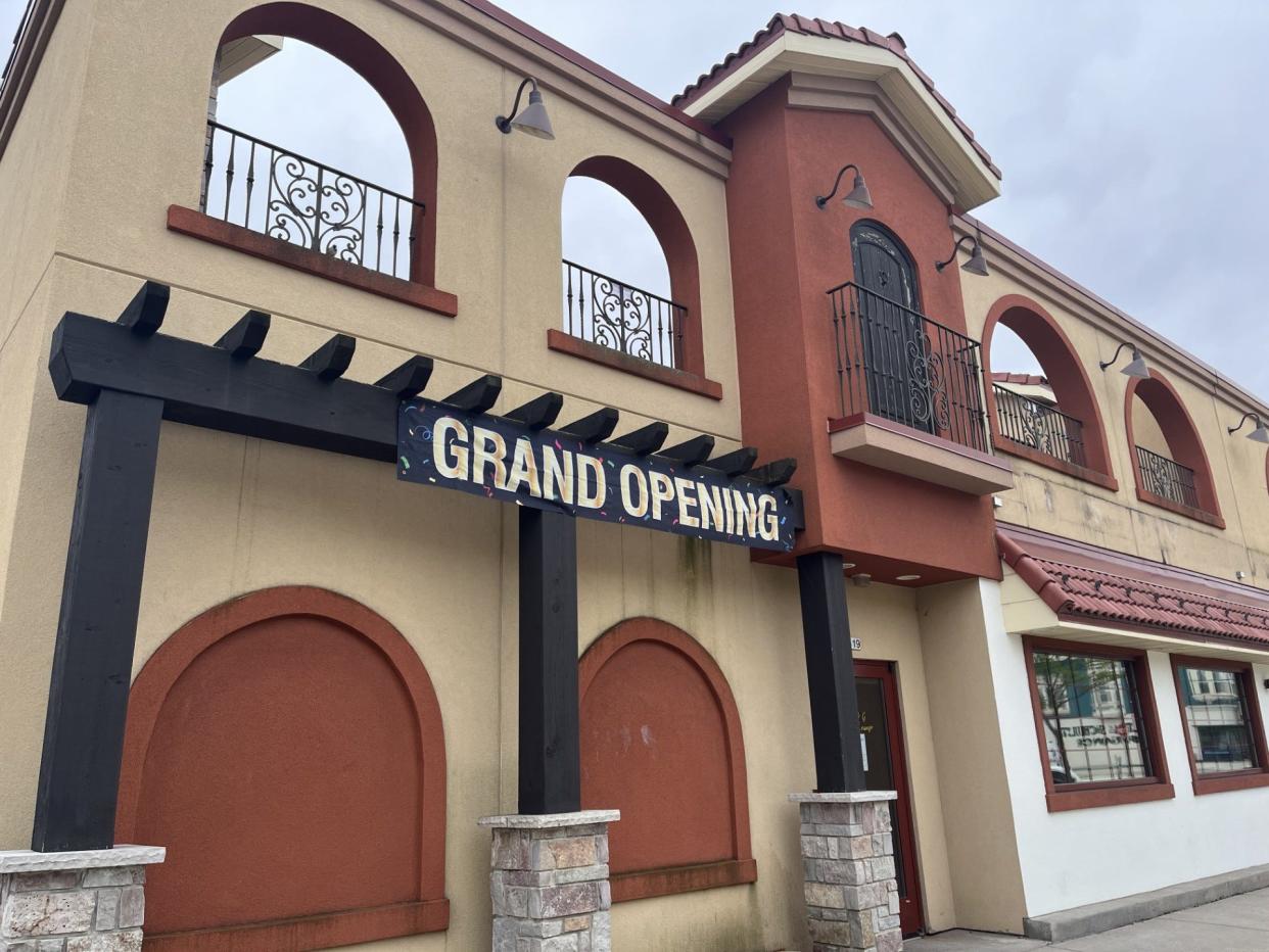 The former El Camino Mexican Restaurant building dons a 'Grand Opening' sign for a new banquet hall and bar business, as seen, Tuesday, April 30 in Sheboygan, Wis.