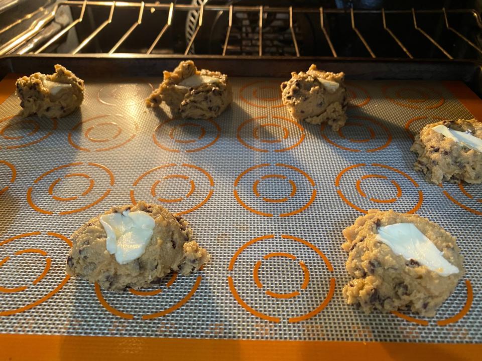 3 buttered cookies in oven