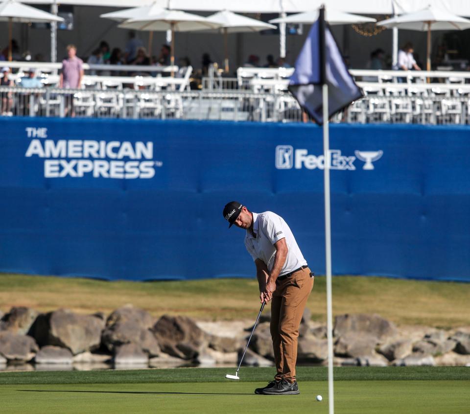 T.J. Vogel putts on 18 on the Pete Dye Stadium course during the second round of the American Express at PGA West in La Quinta, Calif., Friday, Jan. 21, 2022. 