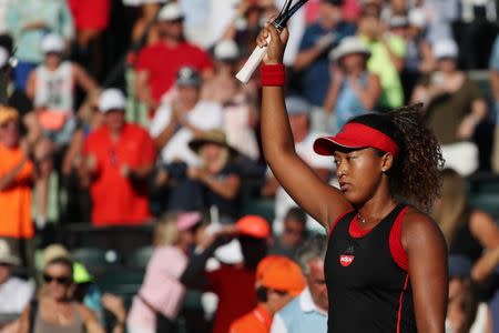 Mar 21, 2018; Key Biscayne, FL, USA; Naomi Osaka of Japan waves to the crowd after her match against Serena Williams of the United States (not pictured) on day two of the Miami Open at Tennis Center at Crandon Park. Osaka won 6-3, 6-2. Mandatory Credit: Geoff Burke-USA TODAY Sports