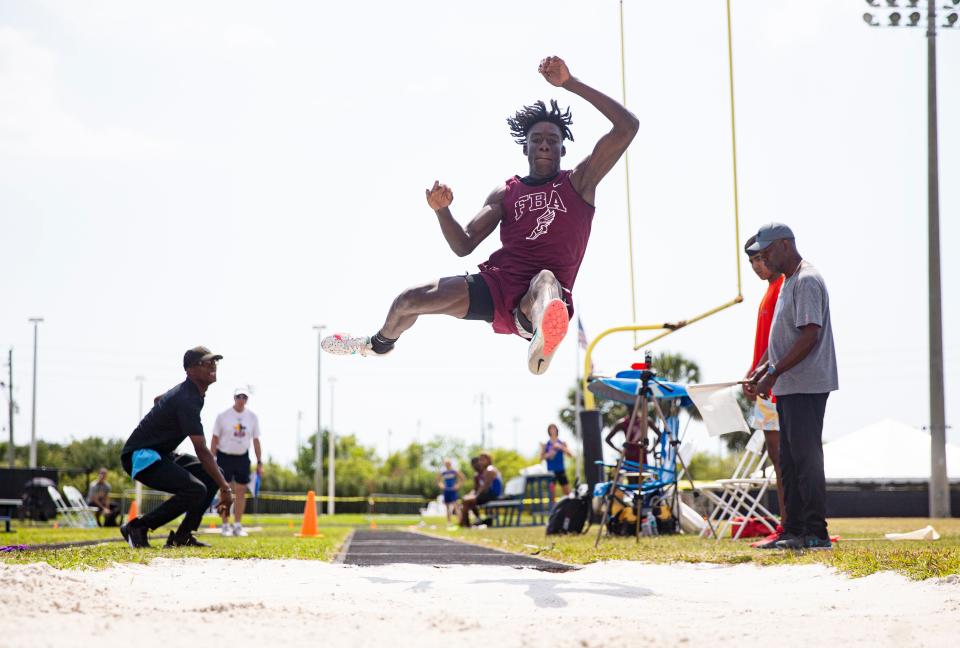 Andrew Azunque of First Baptist Academy competes in the long jump during the FHSAA Class 1A, Region 3 track meet at Community School of Naples on May 6, 2023. He placed second an moves on to the state meet. 