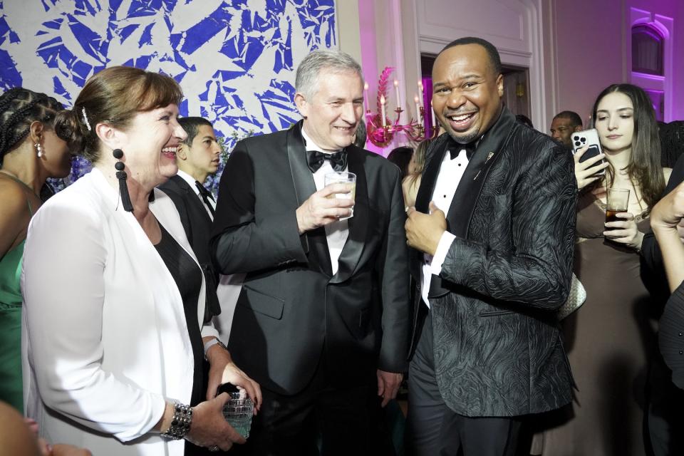 Sabine Raczy, French Ambassador Laurent Bili and Roy Wood Jr. at the CBS News White House Correspondents' Dinner afterparty at the French Ambassador's residence in Washington, D.C., on April 29, 2023.