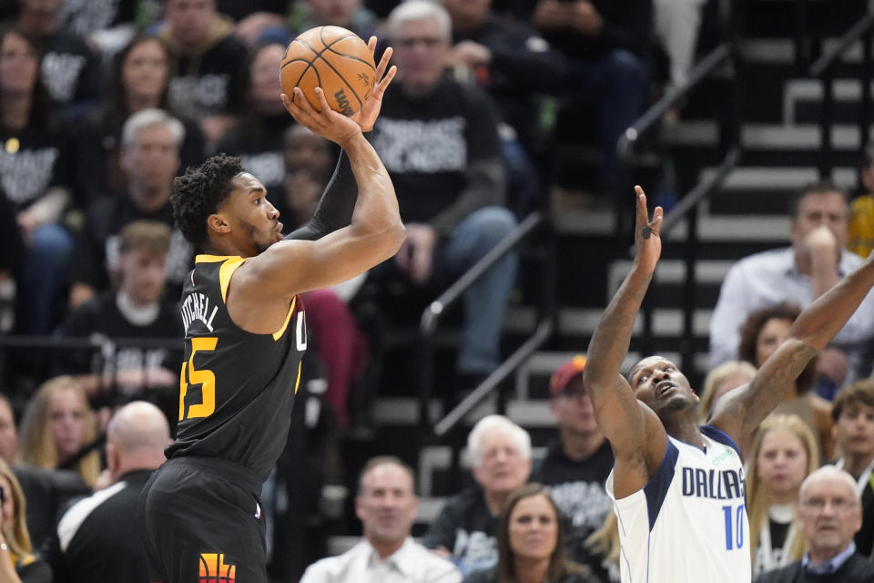 Utah Jazz guard Donovan Mitchell (45) shoots over Dallas Mavericks forward Dorian Finney-Smith (10) in the first half of Game 6 of an NBA basketball first-round playoff series Thursday, April 28, 2022, in Salt Lake City. (AP Photo/Rick Bowmer)