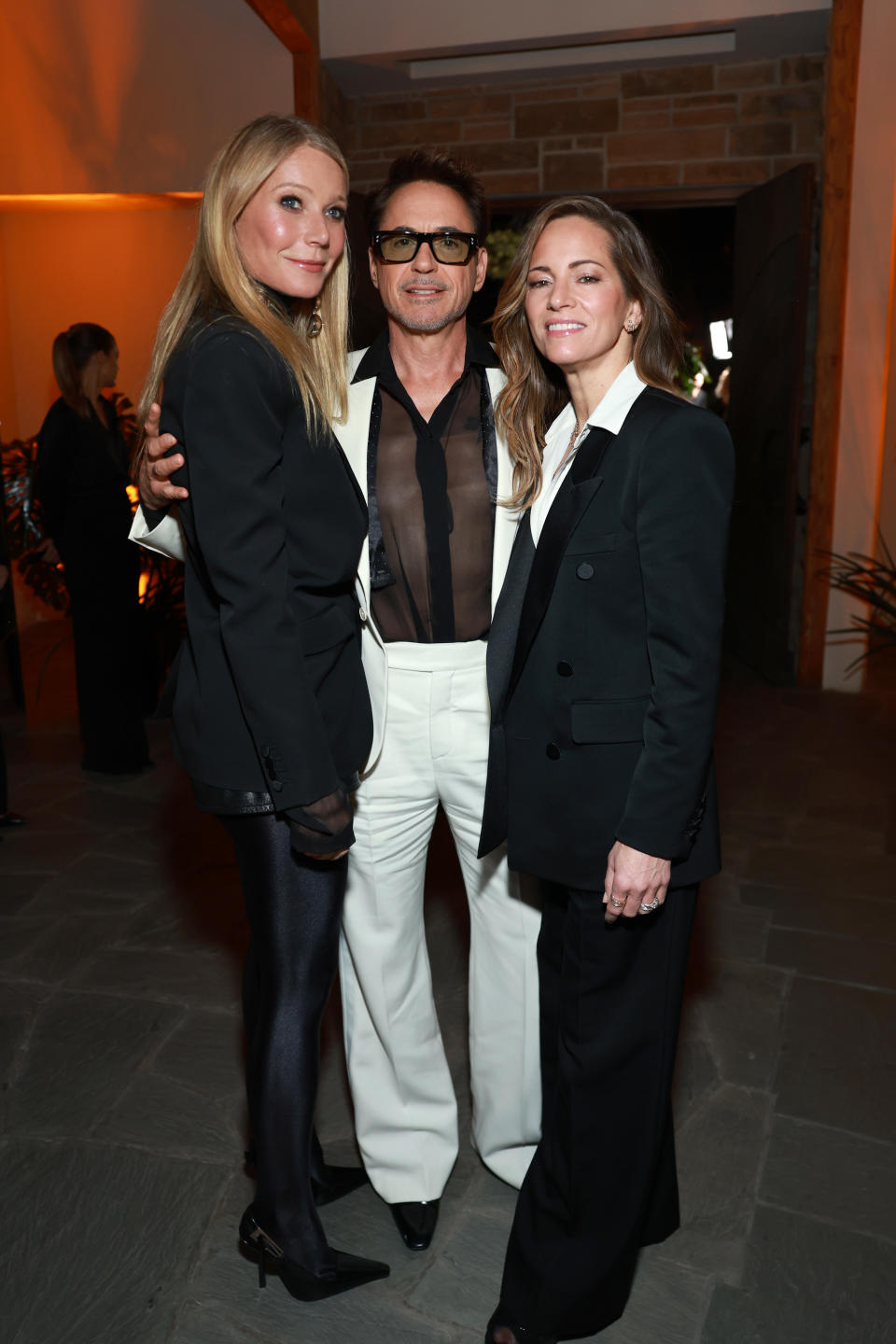 (L-R) Gwyneth Paltrow, Robert Downey Jr. and Susan Downey attend the Saint Laurent x Vanity Fair x NBCUniversal Dinner and Party to Celebrate 'Oppenheimer'