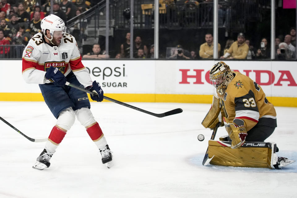 Vegas Golden Knights goaltender Adin Hill (33) blocks the shot of Florida Panthers center Carter Verhaeghe (23) during the first period of Game 2 of the NHL hockey Stanley Cup Finals, Monday, June 5, 2023, in Las Vegas. (AP Photo/John Locher)