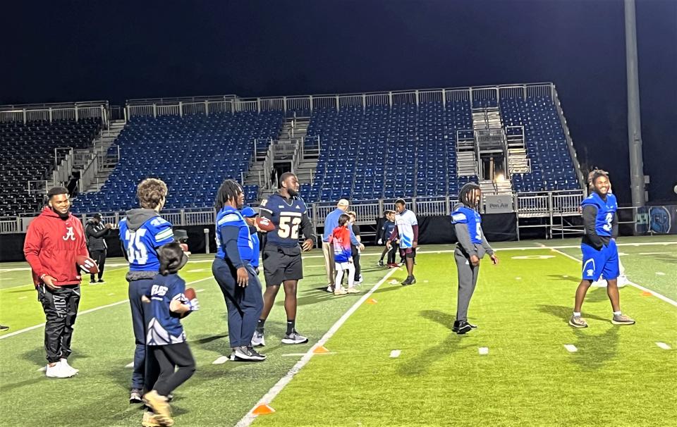 Area youth football players had special night with future NFL players and UWF players in Reese's Senior Bowl clinic Jan. 25 at UWF's Pen Air Field.