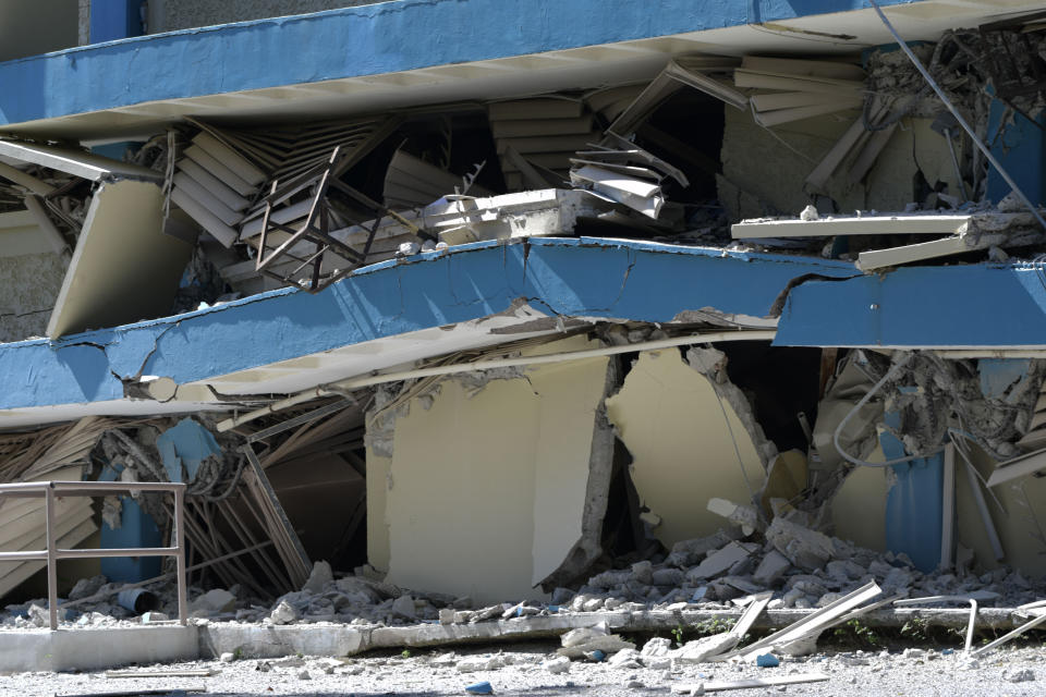 The Adripina Seda public school stands partially collapsed after an earthquake struck Guanica, Puerto Rico, Tuesday, Jan. 7, 2020. A 6.4-magnitude earthquake struck Puerto Rico before dawn on Tuesday, killing one man, injuring others and collapsing buildings in the southern part of the island. (AP Photo/Carlos Giusti)