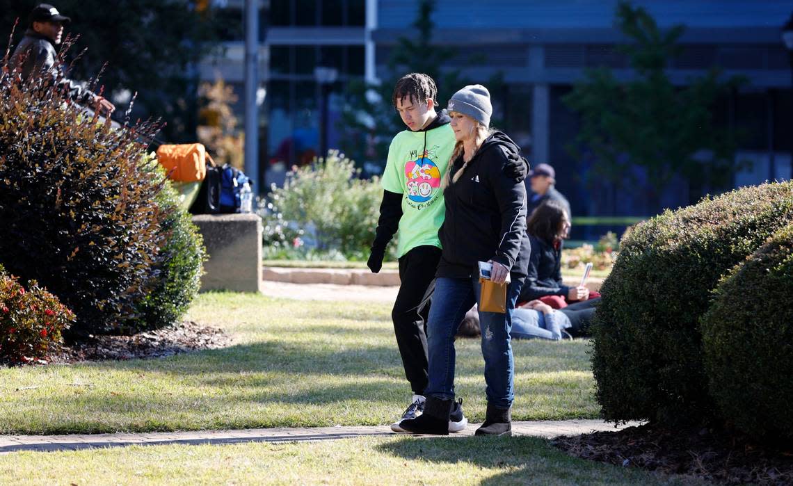 Participants of the dance troupe and adults leave Hillyer Memorial Christian Church after a truck pulling a float went out of control at the Raleigh Christmas Parade injuring at least one person Saturday, Nov. 19, 2022.