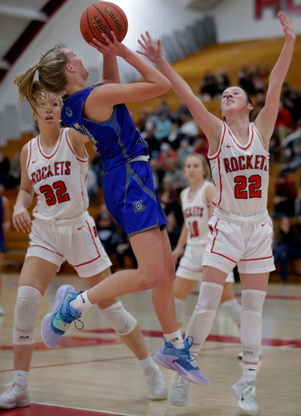 Green Bay Southwest High School’s Addie Pytleski (10) against Neenah High School’s Autumn Schabo (32) and Abbie Fischer (22) during their girls' basketball. on Thursday December, 29, 2022 in Neenah, Wis. Neenah defeated Green Bay Southwest 63-29.Wm. Glasheen USA TODAY NETWORK-Wisconsin