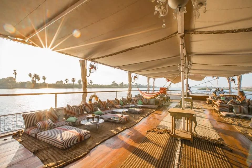 Lounge cushions and hammocks make a comfy spot on a traditional dahabiya boat in Egypt.