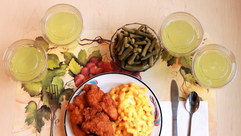 This undated photo provided by the National Institutes of Health in June 2019 shows an "ultra-processed" lunch including brand name macaroni and cheese, chicken tenders, canned green beans and diet lemonade. A new analysis of recent studies says consuming lots of ultra-processed food could lead to dozens of health problems — from obesity and heart disease to cancer, diabetes and even early death.