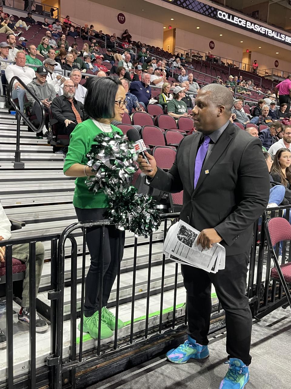 Utah Valley University President Astrid Tuminez talks with ESPN2 sideline reporter Myron Medcalf&nbsp;during the NIT semifinals.