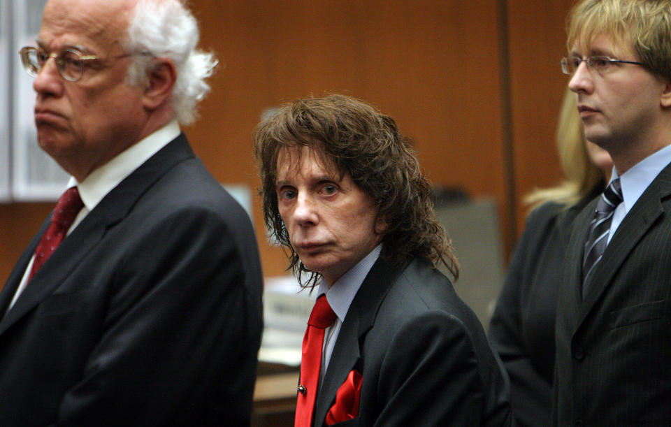 Phil Spector looks at the camera for only a moment as the jurors enter the crowded courtroom with his attorneys Doran Weinberg (left) and Tran Smith (right) at his side before the verdict of guilty is read in the case of People v Phil Spector in Department 106 of the Clara Shortridge Foltz Criminal Justice Center in downtown Los Angeles with Judge Larry P. Fidler presiding on Monday afternoon. (Photo by Al Seib/Los Angeles Times via Getty Images)