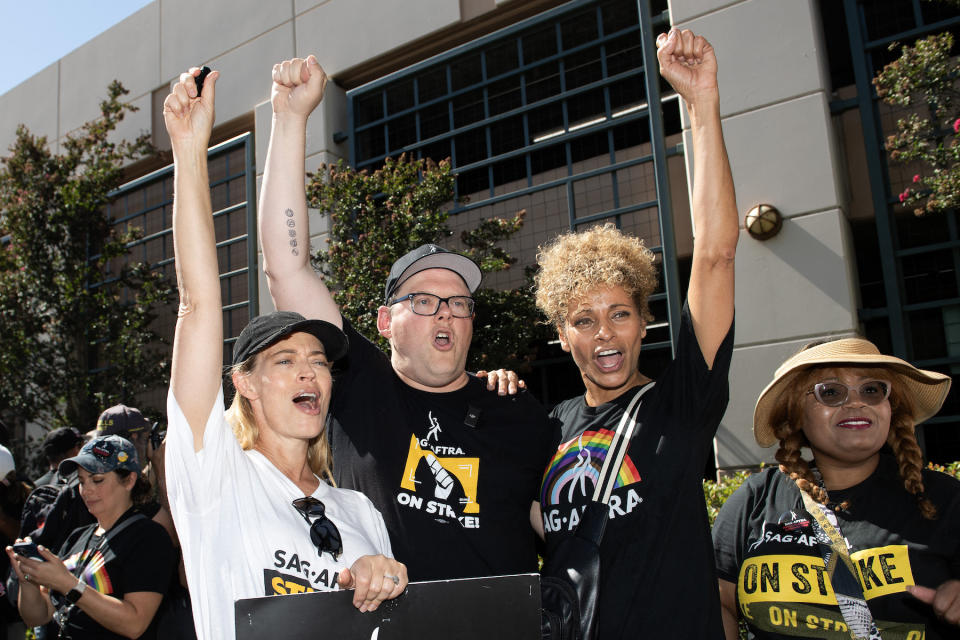 TOPSHOT - (L-R) Actress Jeri Ryan, Duncan Crabtree-Ireland, executive director and chief negotiator for SAG AFTRA, and actress Michelle Hurd protest with the SAG AFTRA members at the picket line outside of Warner Brothers in Burbank, California, on October 3, 2023. The bulk of film and television production across the US has been at a standstill since scribes walked out in early May, being joined by actors in July, all seeking a better deal and assurances their jobs won't be lost to artificial intelligence. (Photo by VALERIE MACON / AFP) (Photo by VALERIE MACON/AFP via Getty Images)