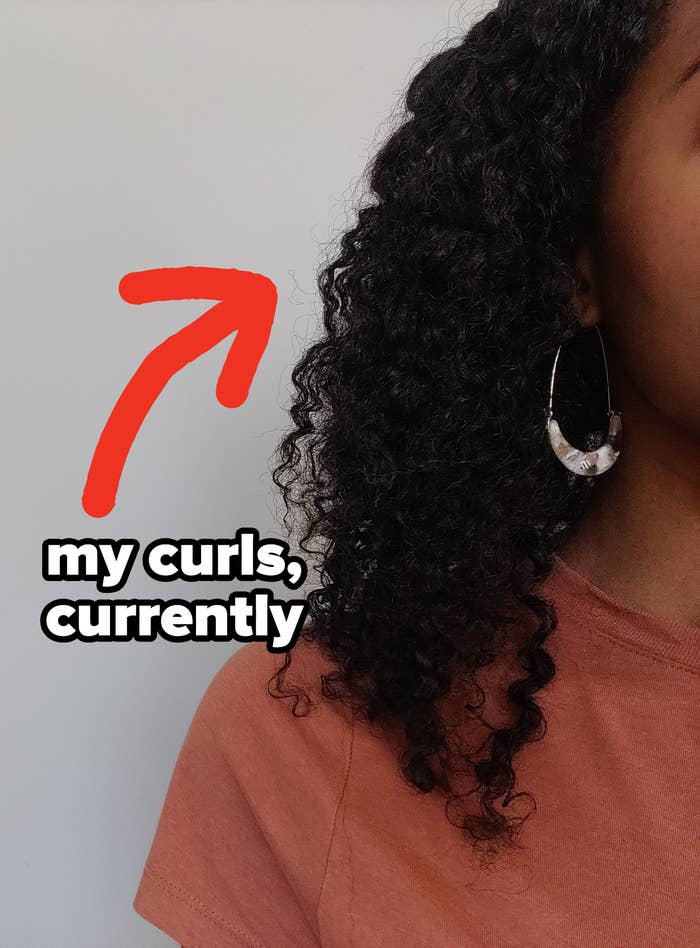 arrow pointing to the author's curls