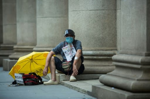 A pro-democracy sits outside Hong Kong's Court of Final Appeal