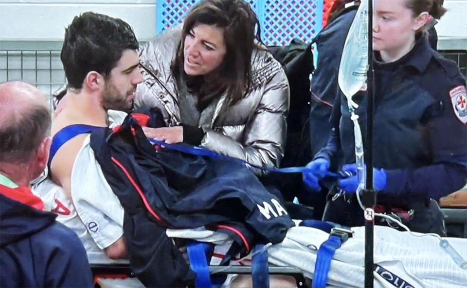 Christian Petracca and his mum in the Melbourne Demons sheds.