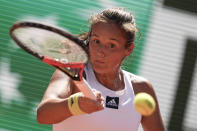 Russia's Daria Kasatkina plays a shot against Poland's Iga Swiatek during their semifinal match at the French Open tennis tournament in Roland Garros stadium in Paris, France, Thursday, June 2, 2022. (AP Photo/Michel Euler)