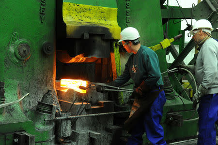 Workers forge at manufacturers Kimber Mills in Cradley Heath, West Midlands, Britain May 15, 2015. Picture taken May 15, 2015. REUTERS/Russ Cockburn
