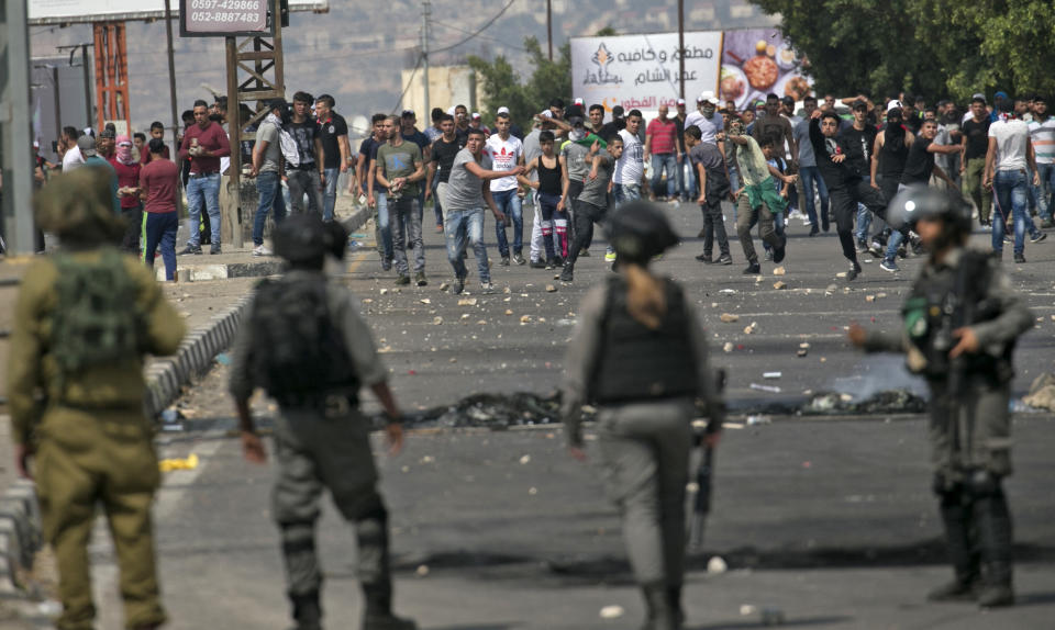 Palestinians clash with Israeli forces