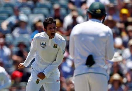 Cricket - Australia v South Africa - First Test cricket match - WACA Ground, Perth, Australia - 4/11/16 South Africa's Keshav Maharaj celebrates after dismissing Australia's captain Steve Smith LBW at the WACA Ground in Perth. REUTERS/David Gray