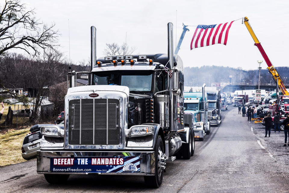 Hundreds of vehicles including 18-wheeler trucks, RVs and other cars depart the Hagerstown Speedway after some of them arrived as part of a convoy that traveled across the country headed to Washington to protest Covid-19 mandates in Hagerstown, Md., on March 6, 2022. (Stephanie Keith / Reuters)