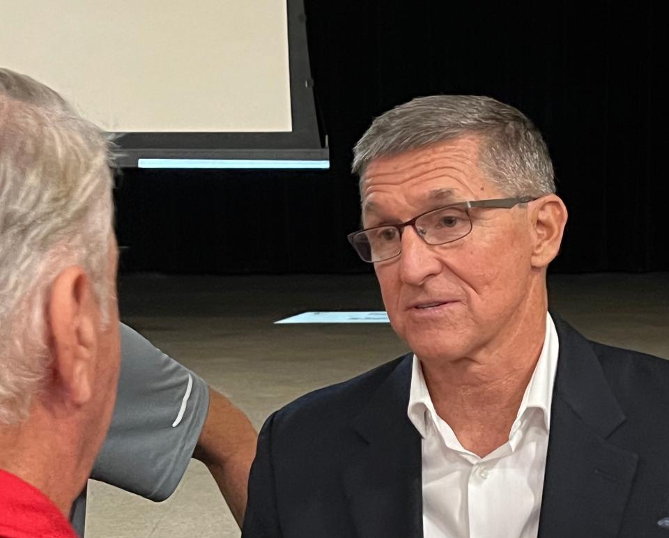 Michael Flynn, former President Donald Trump's first national security adviser and a Sarasota County resident, speaks to members of the audience after a speech to 200 GOP activists in Venice on Wednesday, July 12.