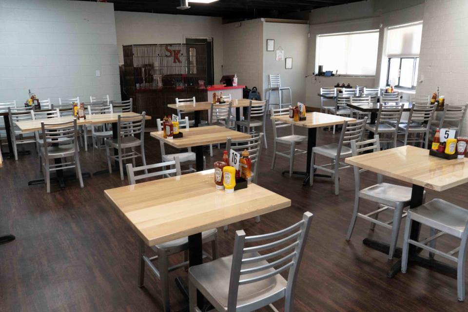 Tables await customers Tuesday at the new SHopper's Kitchen location, 250 S.E. 29th St.