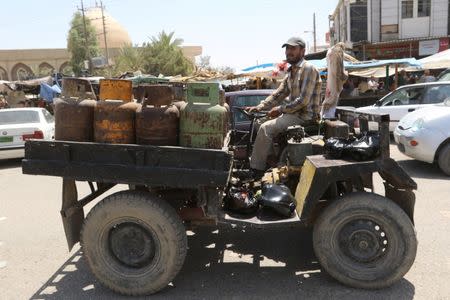 An Iraqi man sells gas jars in the east of Mosul, Iraq, July 19, 2017. REUTERS/Ari Jalal