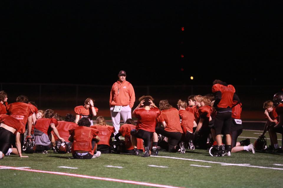 Derick Hammes speaks to the team after a practice before the state title game against Beloit.