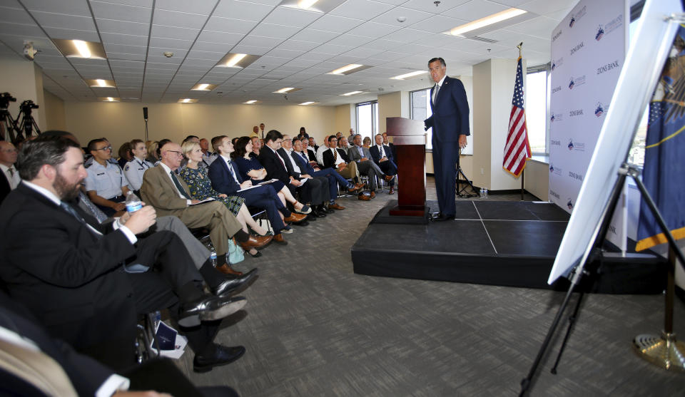 Senator Mitt Romney speaks at the Sutherland Institute in Salt Lake City on Monday, Aug. 19, 2019. Romney says he believes climate change is happening and human activity is a significant contributor. (Scott G Winterton/The Deseret News via AP)