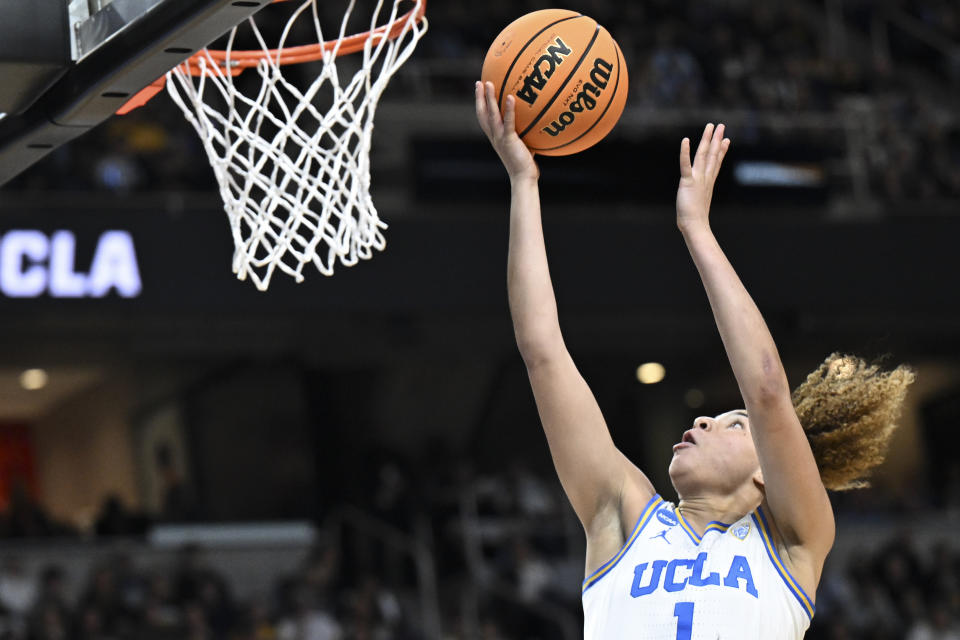 UCLA guard Kiki Rice (1) puts up a shot against the LSU during the second quarter of a Sweet Sixteen round college basketball game during the NCAA Tournament, Saturday, March 30, 2024, in Albany, N.Y. (AP Photo/Hans Pennink)