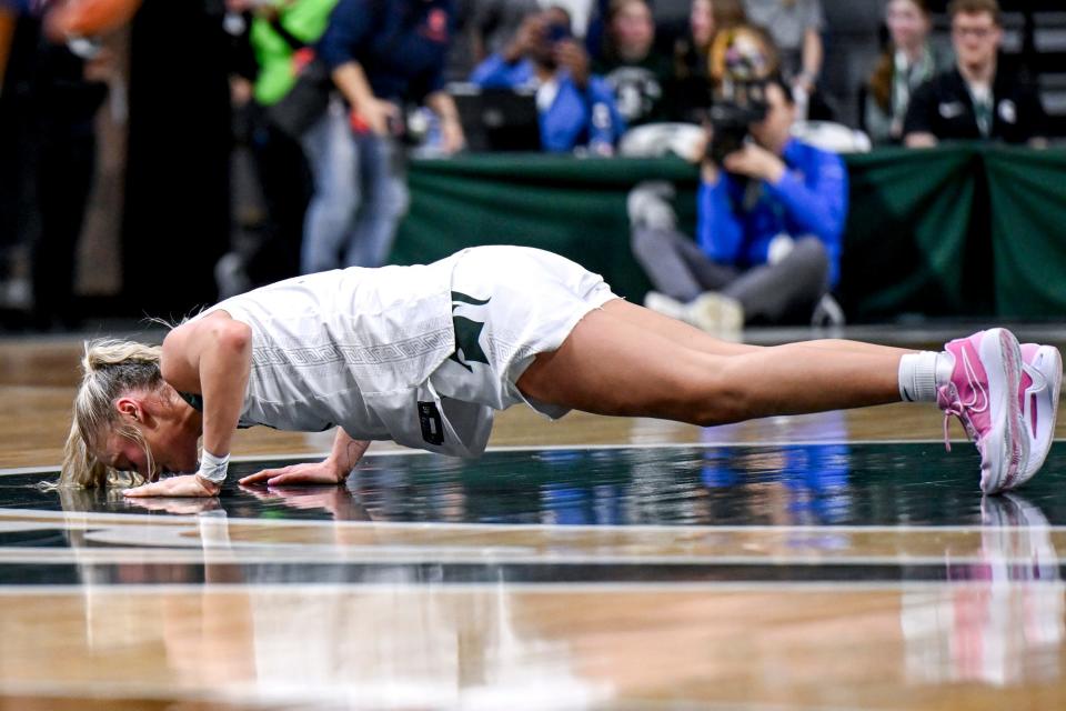 Michigan State senior Tory Ozment kisses the Spartans logo at mid-court before leaving the game against Illinois during the fourth quarter on Thursday, Feb. 29, 2024, at the Breslin Center in East Lansing.