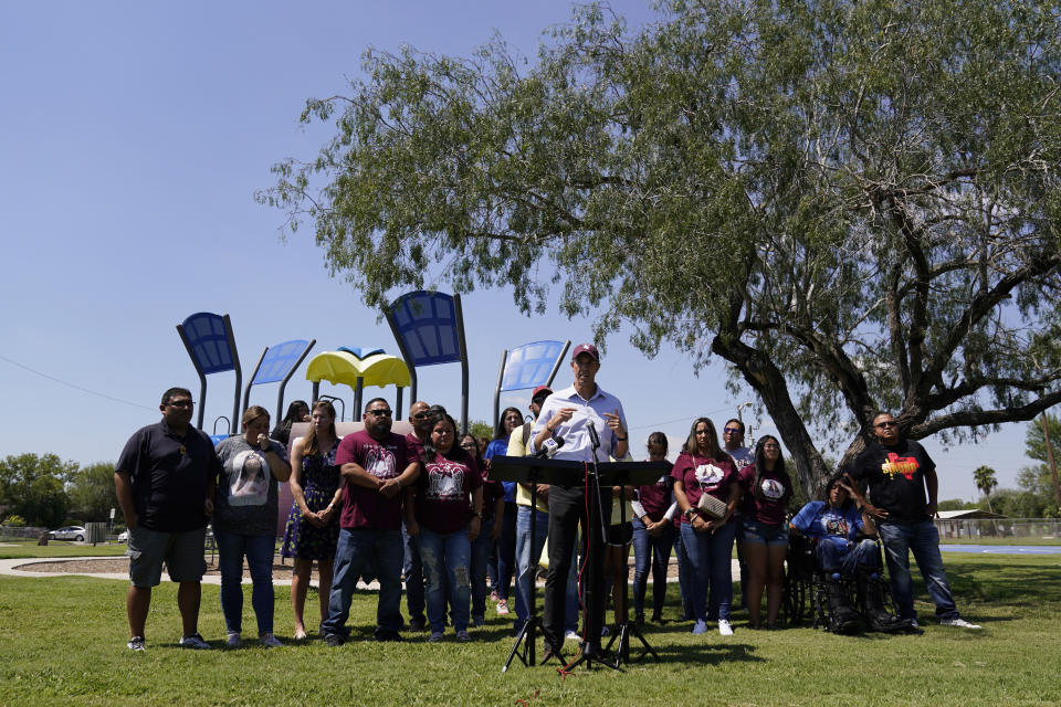 After taking a five-hour bus trip, family of the Uvalde shooting massacre stand with Texas Democratic gubernatorial candidate Beto O'Rourke, center, during a pre-campaign debate news conference, Friday, Sept. 30, 2022, in Edinburg, Texas. O'Rourke will face Gov. Greg Abbott in a debate Friday evening. (AP Photo/Eric Gay)