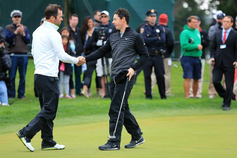 (L-R) Paul Casey of England shakes hands with Rory McIlroy of Northern Ireland after their quarter final match on May 3, 2015 in San Francisco, California