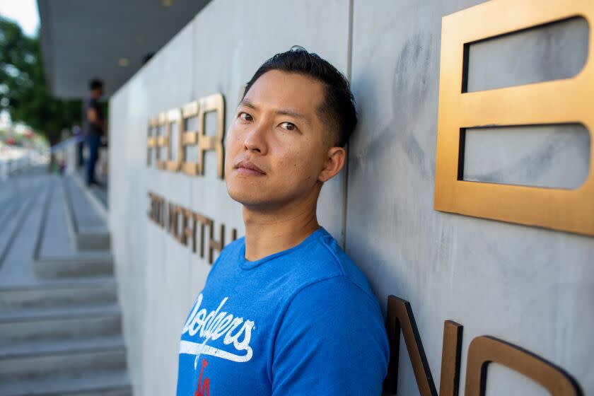 LOS ANGELES, CA - AUGUST 15: Justin Chung poses for a portrait before checking in with immigration agents at the federal building on Monday, Aug. 15, 2022 in Los Angeles, CA. Chung could be deported to South Korea after he was granted clemency by Gov. Brown in 2018 for fatally shooting a man in a drive-by when he was 16. (Jason Armond / Los Angeles Times)