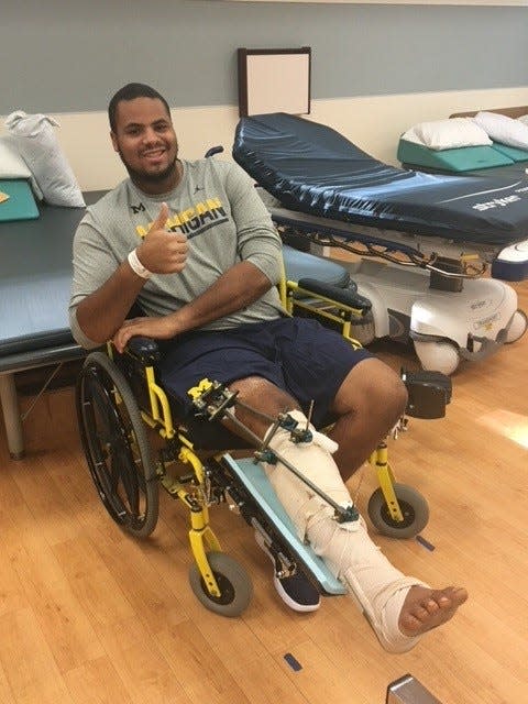 Grant Newsome, former Michigan player turned tight ends coach, in the hospital following surgery to save his leg after a 2016 injury