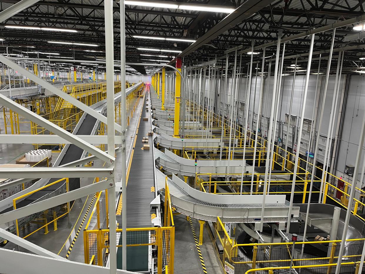 At the vast Amazon fulfillment center in Oxnard, packages move along conveyor rollers. Public health officials are testing workers after one employee was diagnosed with tuberculosis.
