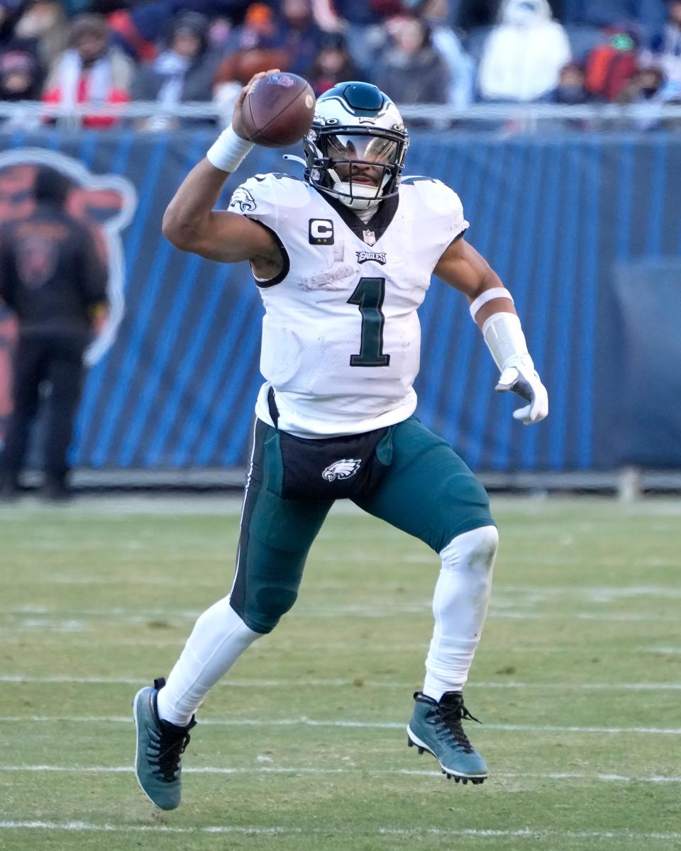 Philadelphia Eagles' Jalen Hurts fakes a pass during a game against the Chicago Bears on Sunday, Dec. 18, 2022, in Chicago.