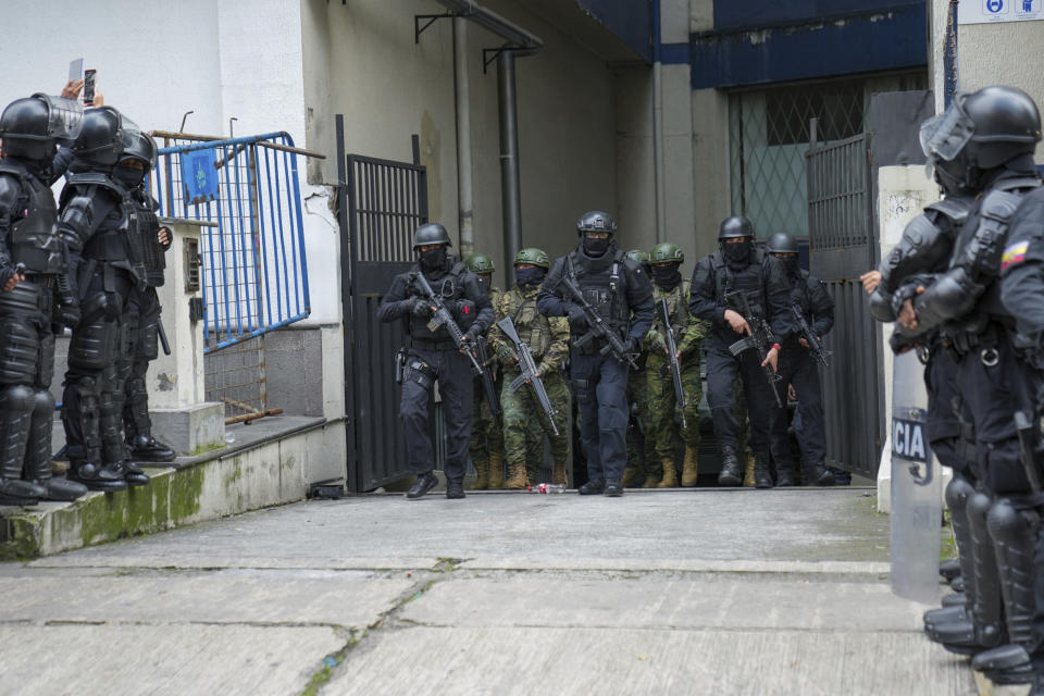 Police and soldiers guard the detention center where former Ecuadorian Vice President Jorge Glas was held after police broke into the Mexican Embassy to arrest him in Quito, Ecuador, Saturday, April 6, 2024. Glas, who held the vice presidency of Ecuador between 2013 and 2018, was convicted of corruption and had been taking refuge in the embassy since December. (AP Photo/Dolores Ochoa)