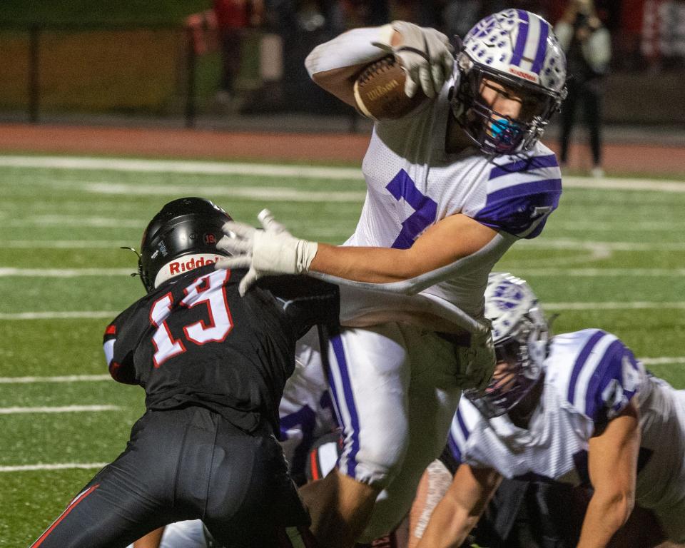Northern York’s Cole Bartram has rushed for 1,400 yards and made 120 tackles this season. Here, he tries to slip the grasp of South Western’s Jackson Ryan (13) in the District 3 Class 5A game on Friday, Nov. 4, 2022.