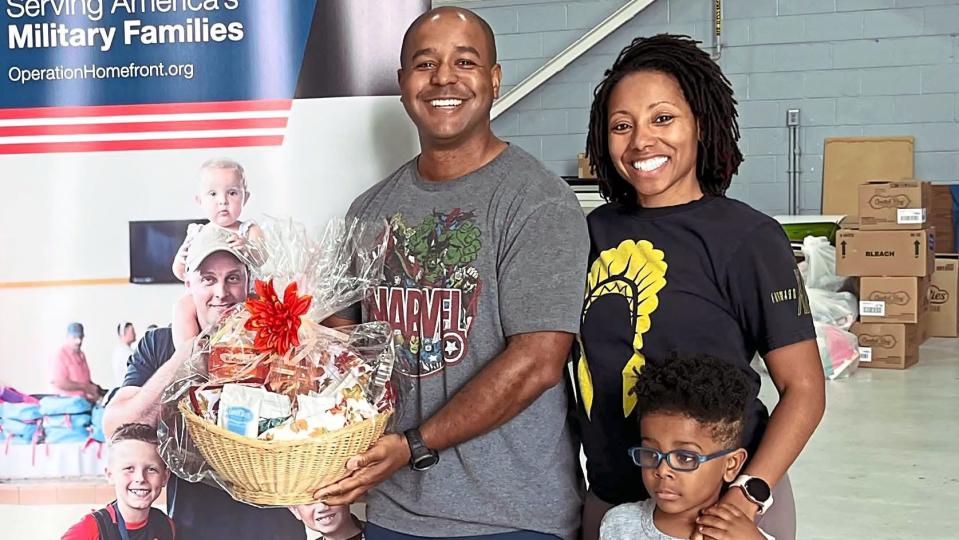 A family that received necessities from Holiday Meals for Military Families event