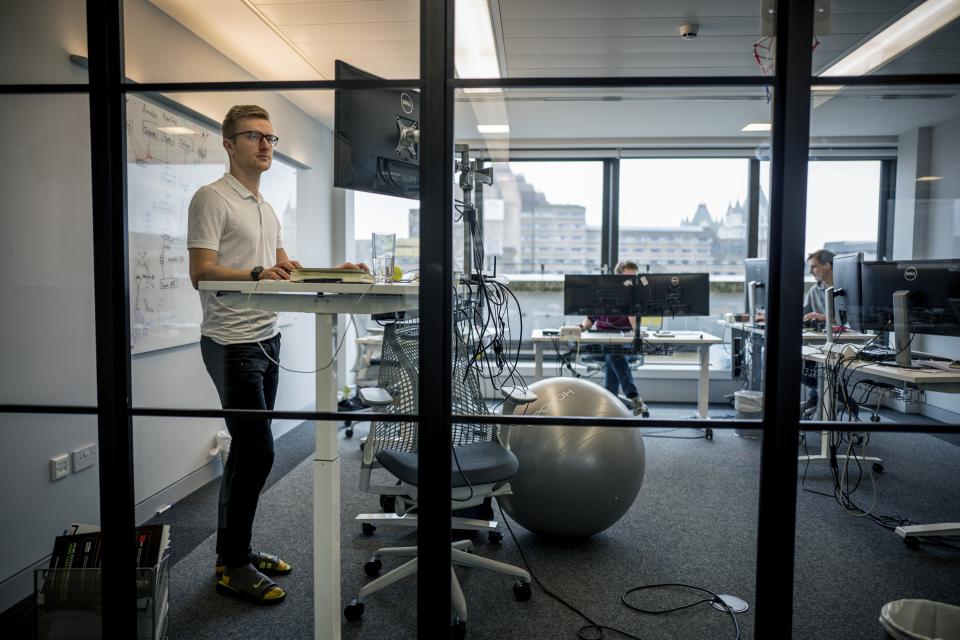 Employees of Smarkets work at their office in central London on March 12, 2018. Against a backdrop in Britain of gender pay gaps and ongoing disputes over executives' earnings, employees at one London company are helping each other set salaries. Betting firm Smarkets has adopted a radical pay transparency policy, through which staff can see colleagues' salaries and have pay rise requests endorsed by peers.  / AFP PHOTO / TOLGA AKMEN / TO GO WITH AFP STORY by Rosie SCAMMELL        (Photo credit should read TOLGA AKMEN/AFP via Getty Images)