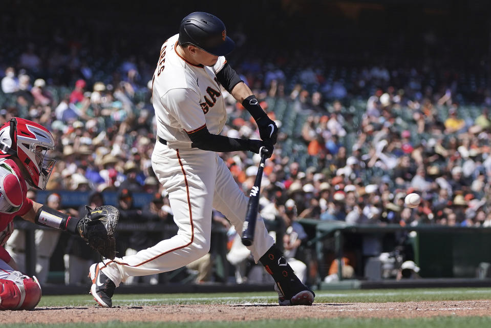 San Francisco Giants' Wilmer Flores hits a double to drive in a run against the Los Angeles Angels during the seventh inning of a baseball game Monday, May 31, 2021, in San Francisco. (AP Photo/Tony Avelar)