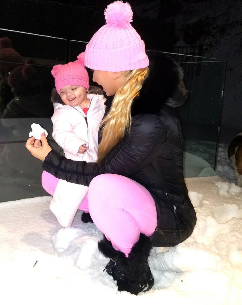 "Introducing Chanel to snow," <a href="https://twitter.com/cocosworld/status/842108929287065601/photo/1" rel="nofollow noopener" target="_blank" data-ylk="slk:writes Coco;elm:context_link;itc:0;sec:content-canvas" class="link ">writes Coco</a>, captioning this pretty-in-pink photo. "She was kinda weirded out by it but then I started acting like the snow was talking to her then she cracked up."