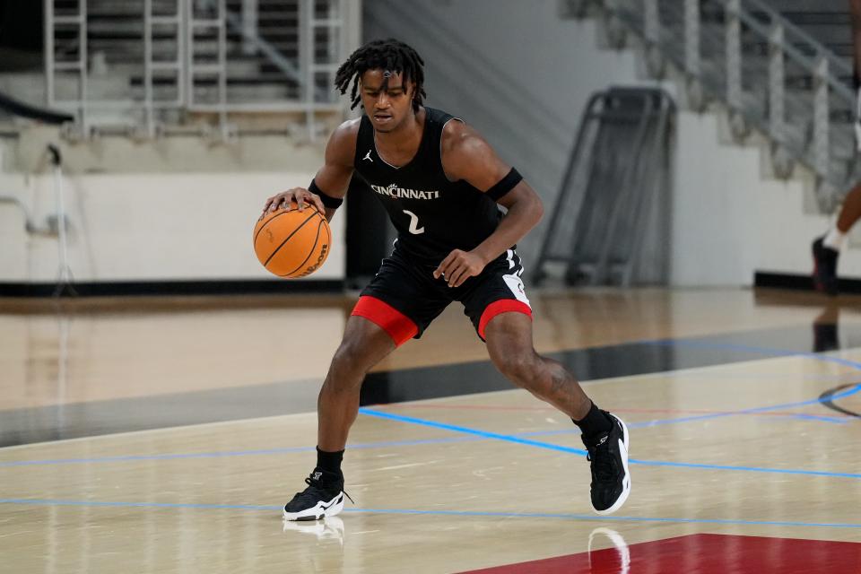 Cincinnati Bearcats guard Jizzle James (2) warms up during a preseason practice at Fifth Third Arena in Cincinnati on Tuesday, Oct. 3, 2023.