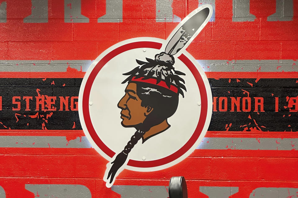 The logo of the Salamanca City Central School District is displayed on a wall at Salamanca High School in Salamanca, N.Y., on April 18, 2023. The school district, located on Seneca Nation of Indians territory, may have to replace its logo after New York passed a ban on the use of Indigenous names, mascots and logos by public schools. (AP Photo/Carolyn Thompson)